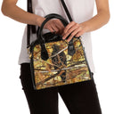 Shoulder handbag featuring a red-shouldered hawk in a tree near tennis courts (Florida) - on model
