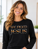 Woman wearing black We Need Jesus long sleeve tee featuring Mount Dora Florida sunset lettering