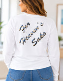 Back view of white long sleeve tee with For Heaven’s Sake lettering filled with an Aruba sunrise photograph