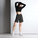 Front view of female model in unisex mesh shorts with monochrome dahlia pattern — Victoria Island Monochrome Charm