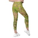 Women’s crossover leggings with pockets featuring foxtail fountain grass in green and pinkish-tan tones photographed in Yorba Linda, California