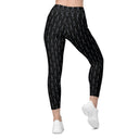 Women’s crossover leggings with pockets featuring a dark repeating Eiffel Tower pattern and Paris detail