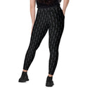 Women’s crossover leggings with pockets featuring a dark repeating Eiffel Tower pattern and Paris detail