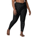 Women’s crossover leggings with pockets featuring a dark repeating Eiffel Tower pattern and Paris detail