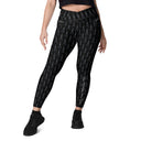 Women’s crossover leggings with pockets featuring a dark repeating Eiffel Tower pattern and Paris detail