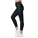 Women’s crossover leggings with pockets featuring a dark repeating Eiffel Tower pattern and Paris detail