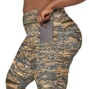 Left pocket view of female model wearing crossover-waist leggings with all-over Cliffs of Moher rock-layer pattern (Nature’s Pattern) by Images On Me.