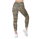 Back view of female model wearing crossover-waist leggings with all-over Cliffs of Moher rock-layer pattern (Nature’s Pattern) by Images On Me.