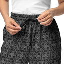 Front close-up view of model in unisex wide-leg joggers with monochrome dahlia pattern — Victoria Island Monochrome Charm