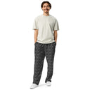 Front view of male model in unisex wide-leg joggers with monochrome dahlia pattern — Victoria Island Monochrome Charm