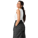Left back view of female model in unisex wide-leg joggers with monochrome dahlia pattern — Victoria Island Monochrome Charm