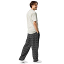 Right back view of male model in unisex wide-leg joggers with monochrome dahlia pattern — Victoria Island Monochrome Charmv