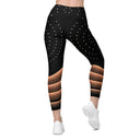 model back Women’s crossover leggings with pockets featuring a black and bronze architectural print from the Dr. Phillips Center for the Performing Arts in Orlando