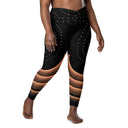 model front Women’s crossover leggings with pockets featuring a black and bronze architectural print from the Dr. Phillips Center for the Performing Arts in Orlando