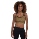 model front Padded women’s Vaulted Glory sports bra with a warm gold geometric pattern inspired by Gothic fan-vault architecture in London