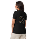 black Back view of model wearing women’s We Need Jesus Sunset V-neck tee reading For Heaven’s Sake with sunset-filled lettering