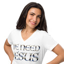 white close-up of model wearing Women’s We Need Jesus Sunrise V-neck tee with lettering filled with an Aruba sunrise photograph